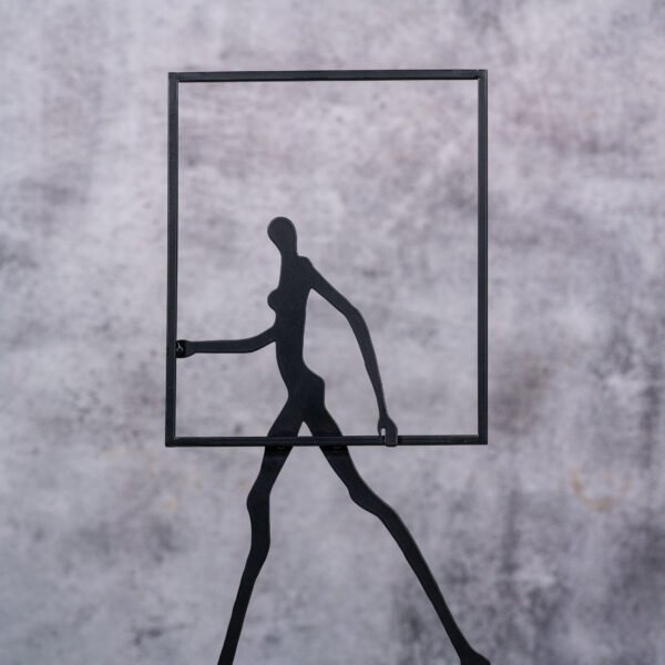 A Stylized Human Figure Carrying a Square Frame, functioning as a Modern Minimalist  Decorative Sculpture