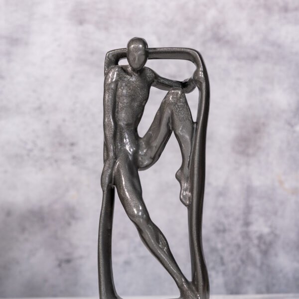 A Silvered Bronze Figure in Abstract Embrace, Capturing the Essence of Solitude and Strength within a Modern Framework