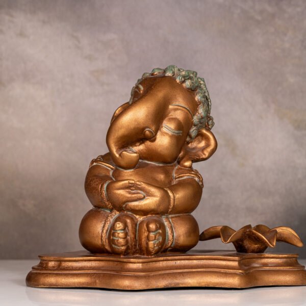 Oxidized Copper Finish Lord Ganesha Sitting Idol with Lotus Diya, a Symbol of Wisdom, Prosperity, and Obstacle Removal