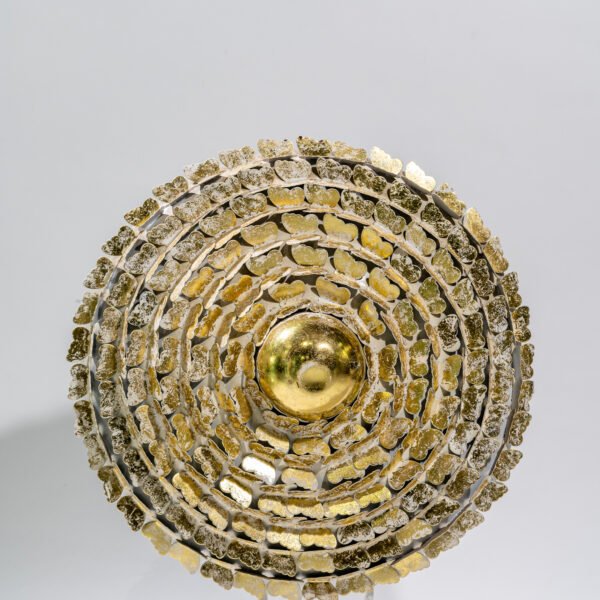 An Ornate, Concentric Circular Art Piece Featuring a Central Golden Dome Surrounded by Rings of Textured Metallic