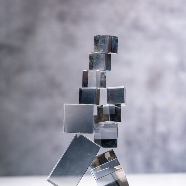 A Precarious Arrangement of Reflective Cubes: An Abstract Study of Balance and Light in Glass Geometry